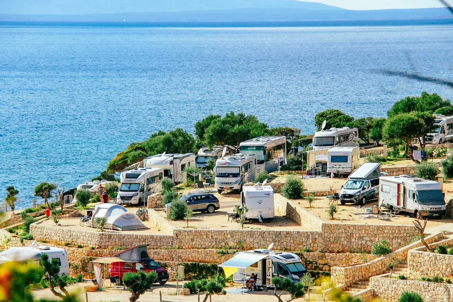 Motorhomes parked considerately by the sea