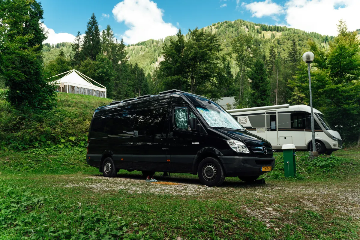 A motorhome parked quietly among trees